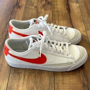 Nike Blazer Low '77 VNTG sneakers in white and team orange.